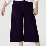 Petite Height Model wears a size 10 in the short length Bradley Culottes. The Bradley Culotte in Purple is the perfect addition to your workwear wardrobe, offering a stylish yet comfortable option for the modern woman. Made from our luxurious jersey base, these culottes drape beautifully. Available in sizes 8-24 and in 2 lengths. 