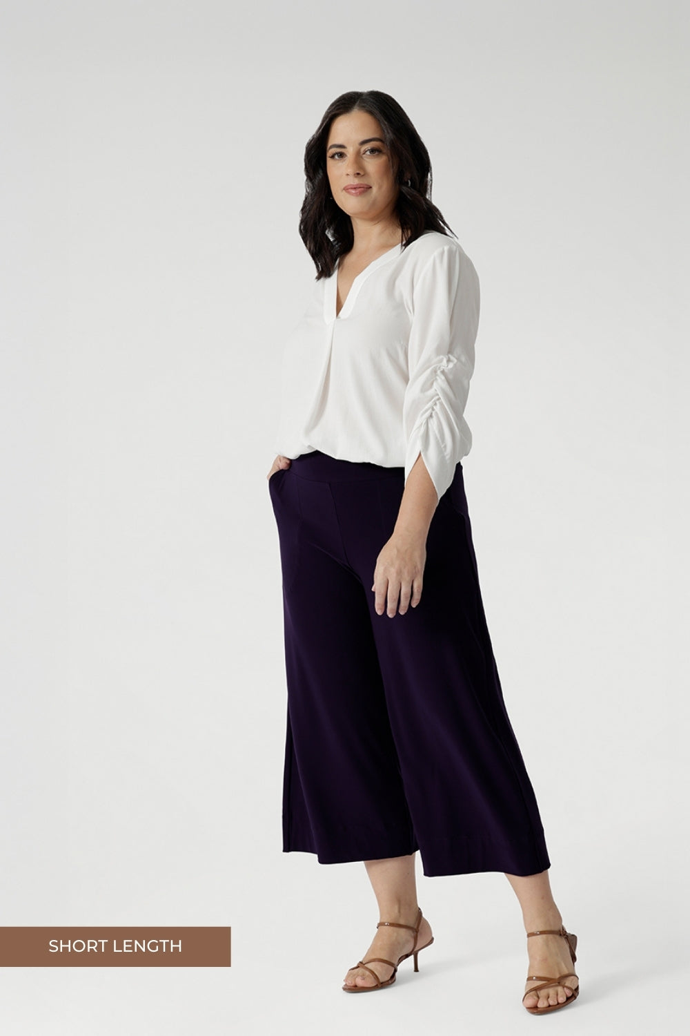 The Bradley Culotte in Purple is the perfect addition to your workwear wardrobe, offering a stylish yet comfortable option for the modern woman. Petite Height Model wears a size 10 in the short length Bradley Culottes