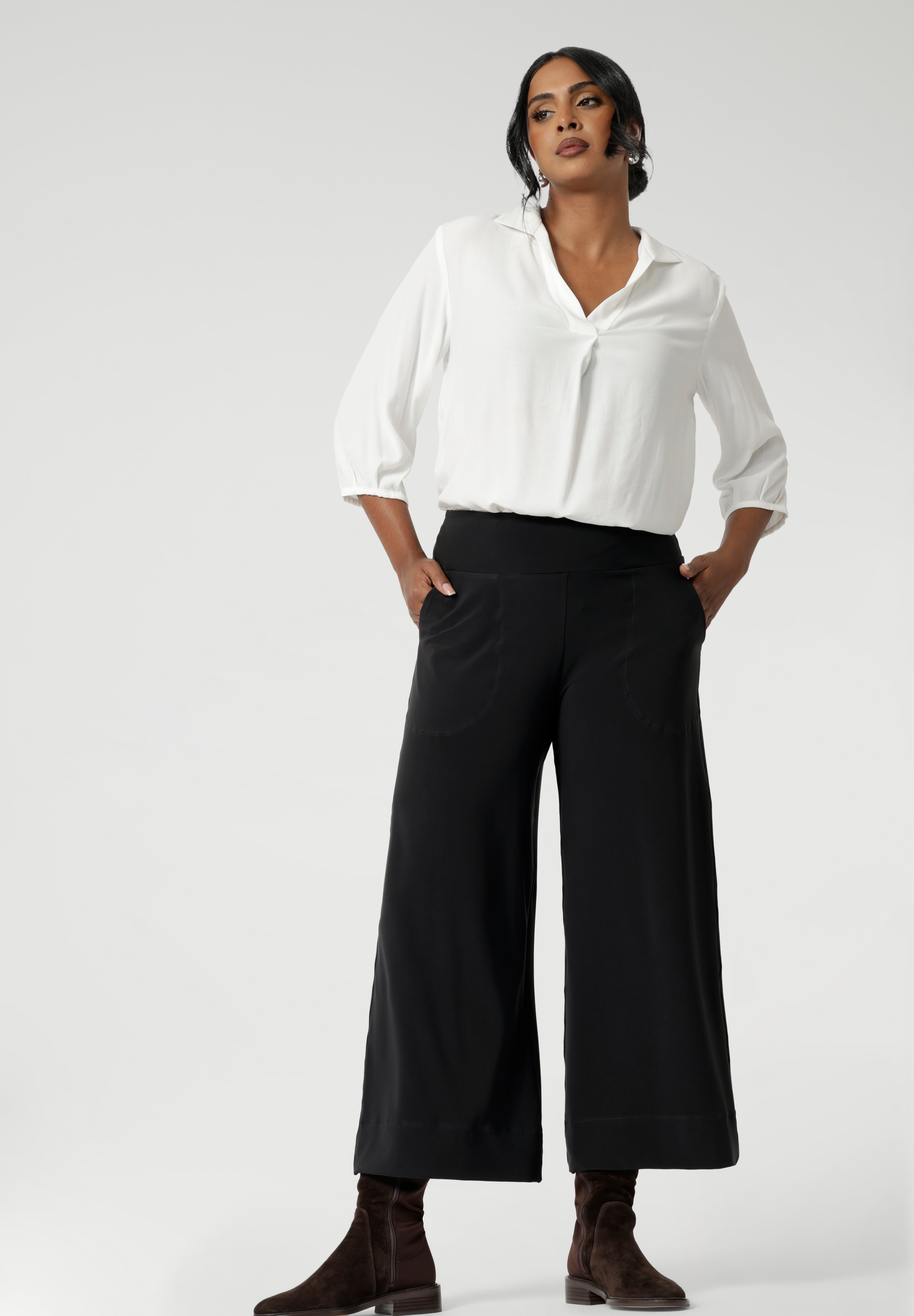 The Bradley Culotte in Charcoal is the ultimate combination of style, comfort, and practicality for your workwear wardrobe. Crafted from our luxe jersey fabric, these pants drape beautifully, offering a sophisticated look and unmatched comfort throughout the day.