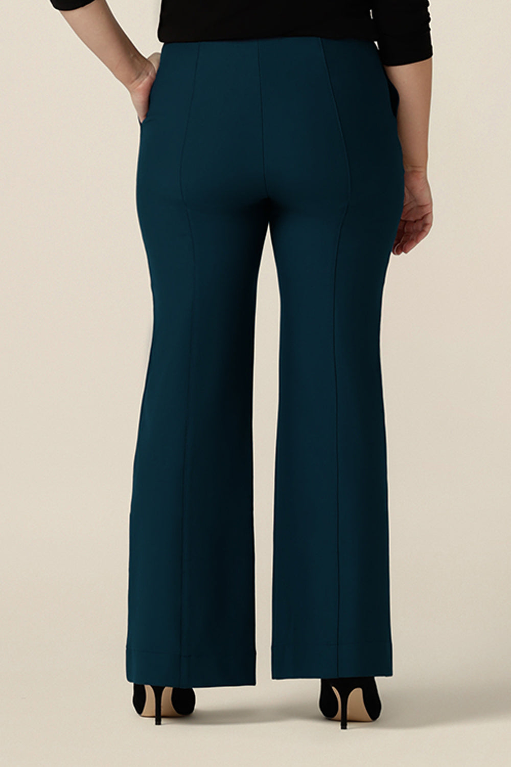 Back view of petrol blue, tailored bootcut pants, size 10. Made in Australia in ponte fabric, these comfortable work pants are great for curvy women - shop in sizes 8 to 24.