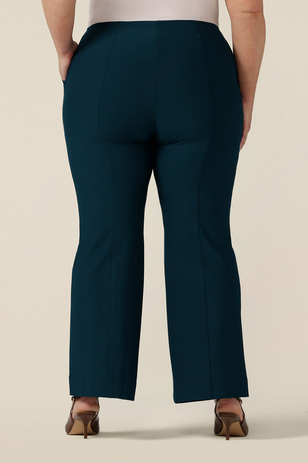 Back view of petrol blue, tailored bootcut pants, size 18. Made in Australia in ponte fabric, these comfortable work pants are great for fuller figure women - shop in sizes 8 to 24.