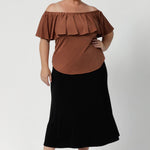 The Briar Top can be worn three ways to suit your mood or the occasion. You can wear it off the shoulder for a relaxed yet elegant look, or as a one-shoulder top for a more daring, asymmetrical style. The elasticated neckline with a deep frill adds a feminine touch while ensuring a comfortable, secure fit.