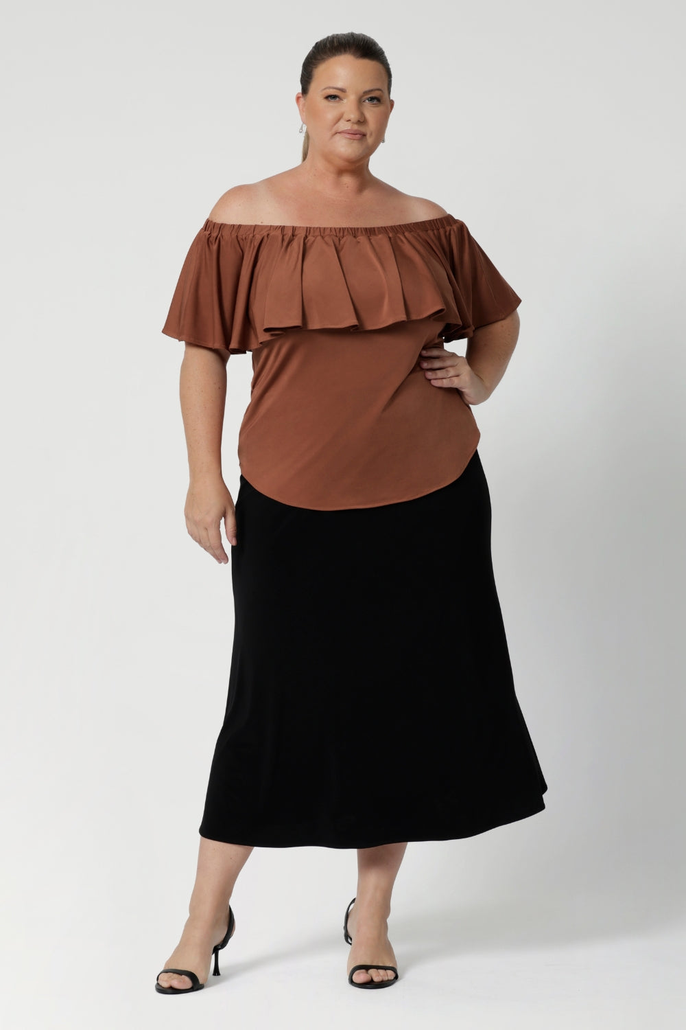 The Briar Top can be worn three ways to suit your mood or the occasion. You can wear it off the shoulder for a relaxed yet elegant look, or as a one-shoulder top for a more daring, asymmetrical style. The elasticated neckline with a deep frill adds a feminine touch while ensuring a comfortable, secure fit.