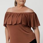The Briar Top is a versatile and stylish addition to your workwear wardrobe, offering the perfect balance of sophistication and flexibility. Made from a luxurious slinky jersey, it provides full body stretch for ultimate comfort and ease of movement. In a warm neutral clay colour that pairs effortlessly with everything, this top is a chic and timeless piece that complements any outfit.