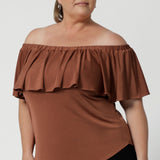 The Briar Top is a versatile and stylish addition to your workwear wardrobe, offering the perfect balance of sophistication and flexibility. Made from a luxurious slinky jersey, it provides full body stretch for ultimate comfort and ease of movement. In a warm neutral clay colour that pairs effortlessly with everything, this top is a chic and timeless piece that complements any outfit.