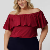 Introducing a versatile red top that can be styled in three chic ways! This piece is crafted from high-quality slinky jersey fabric, ensuring a comfortable fit that drapes beautifully. The vibrant red colour makes it perfect for the season, adding a bold pop to your wardrobe. Proudly Australian made, this top combines style and quality effortlessly, allowing you to express your unique fashion sense with ease. Whether you dress it up or keep it casual, this top is a must-have for any occasion! 8-24 sizes.