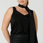 A shimmering jersey neck tie in black puts the finishing touch to a long sleeve, sparkly jersey top for an evening event look. Made in Australia by women's clothing and occasionwear brand, L&F.