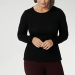 Stay effortlessly stylish through the cooler months with this luxuriously soft knit top, crafted from a premium Tencel wool blend. Designed for comfort and versatility, it features a flattering close-to-body fit that moves with you, thanks to its generous stretch and breathable finish. Black knit top has thumbholes that can be used or tucked away for versatility in styling and extra warmth. 