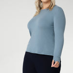 Crafted from a luxe blend of Tencel wool, this soft knit top is your go-to light layer for the cooler months. Featuring a classic round neckline and long sleeves, it’s designed with comfort in mind — offering generous stretch and a smooth, breathable feel, without the itch of traditional merino. Worn solo or layered under a jacket or coat, it pairs effortlessly with your favourite pants or skirts for an elegant, everyday look.