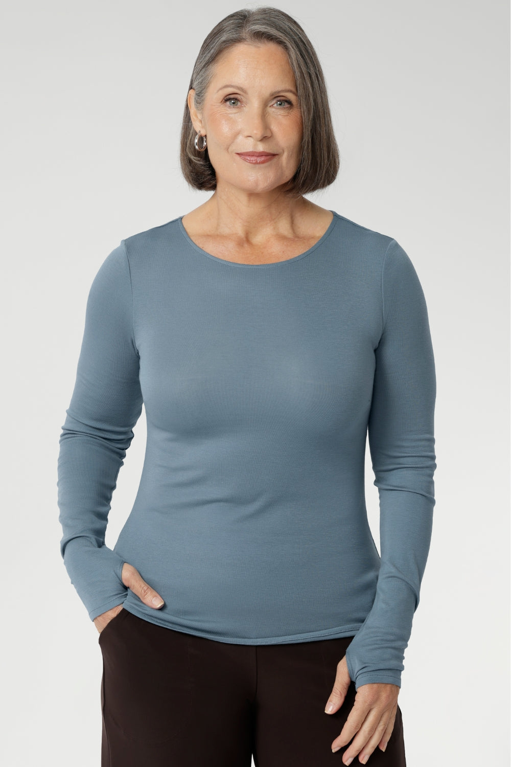 Stay effortlessly stylish through the cooler months with this luxuriously soft knit top, crafted from a premium Tencel wool blend. Designed for comfort and versatility, it features a flattering close-to-body fit that moves with you, thanks to its generous stretch and breathable finish. 