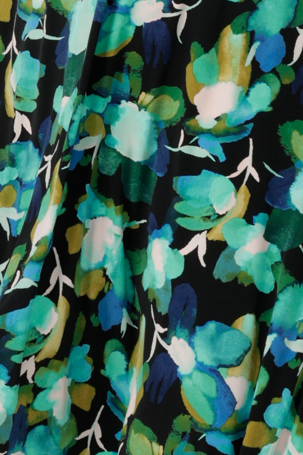 A canopy print fabric with a green print on a black base. Made in Australia for women size 8 - 24. 