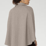 Unlike traditional belted coats, the back of this cape remains free from the tie, allowing the fabric to drape beautifully for full range of motion and an elegant finish. 