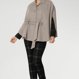 Ideal for layering, it delivers a spacious yet flattering fit designed to move with you through winter in effortless style.The tailored silhouette is enhanced with three front buttons that fasten cleanly across the chest, while a cleverly designed waistband wraps around the back and threads through discreet loop holes to cinch the waist.
