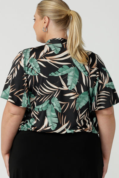 Tropical printed shrug cardigan. Featuring a leaf print on a black background. Ruched waist tie detail tie detail. Great layering piece. Ladies inclusive sizing. 