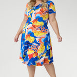 Crafted from our signature slinky jersey with a cool, silky feel and gentle stretch, the Casey Dress in Summer Bliss combines effortless comfort with feminine flair. Featuring a softly draped cowl neckline, blouson bodice, and an asymmetrical skirt, this piece is finished with shoulder-tucked sleeves and a striking floral print. A lightweight favourite for holidays, weekends, and sun-soaked days. Proudly made in Australia.