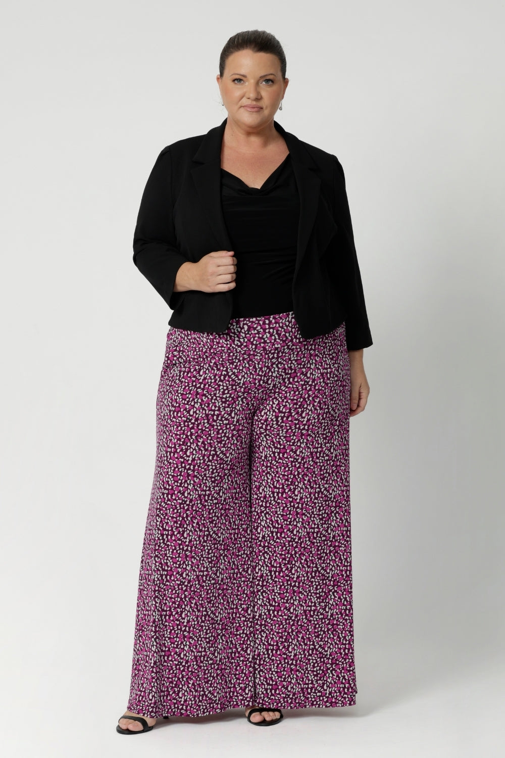 Wide leg pants perfect for occasion wear come in a stunning colors palette of magenta, pink, graphite, and vanilla. Dynamic pattern that adds interest without being overwhelming. Available in sizes 8-24.