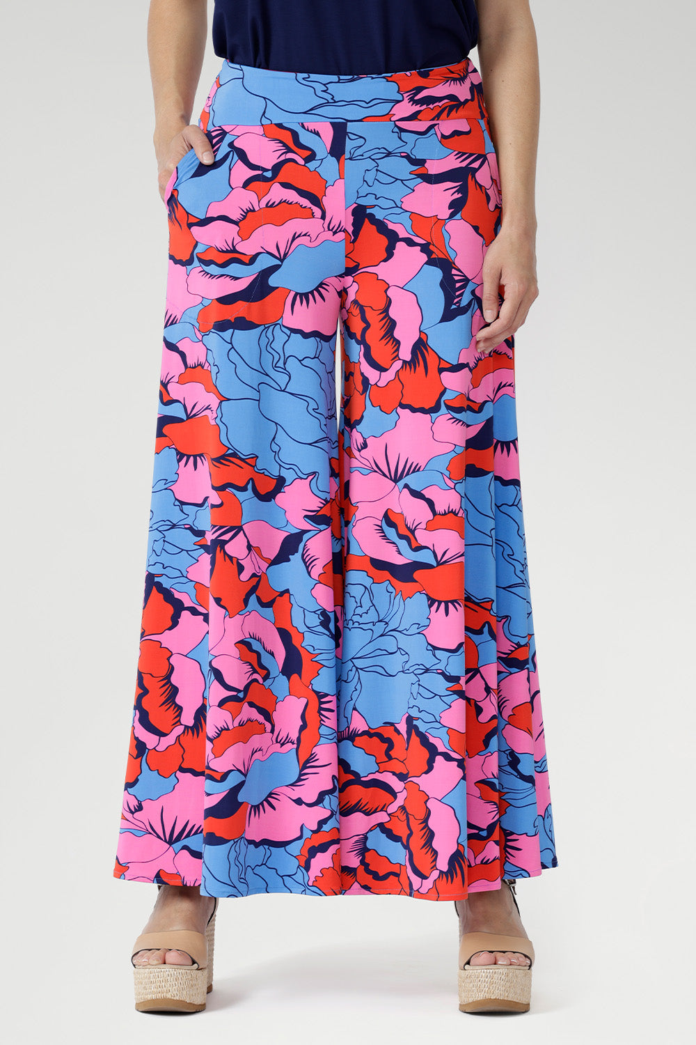 Crafted from slinky stretch jersey, the Caspian Palazzo Pant in Can Can offers a fluid drape and effortless comfort. 