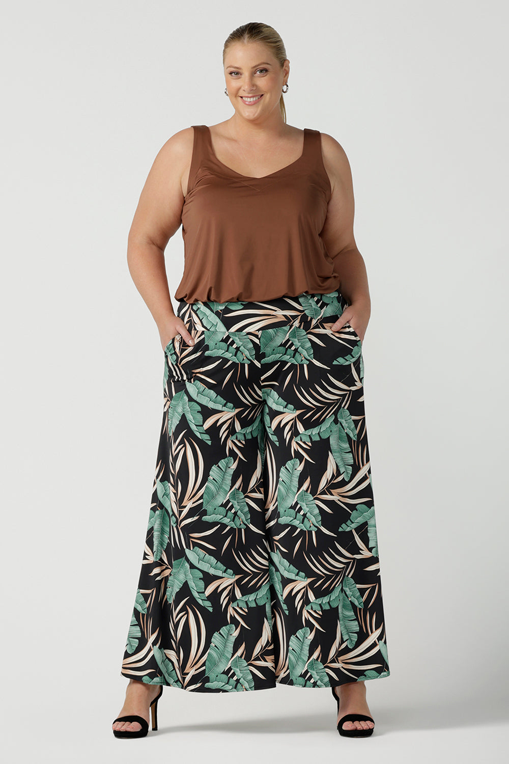 A great plus size cami top for casual weekend wear or event dressing. Eddy Cami in Clay has wide shoulder straps, a soft V-neckline and loose fitting slinky jersey body. Made in Australia by Australian fashion brand, Leina & Fleur.