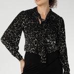 The striking animal burnout print is set against a soft, stretchy black jersey base that offers comfort without compromising on style.