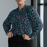The Celine Top brings refined drama to cool-weather dressing, blending softness, structure, and statement detail in one beautifully cut piece. With its elegant V-neckline and flowing attached neck ties, this blouse offers effortless sophistication, while subtle tailored tucks at the back create a graceful shape that moves easily with the body.