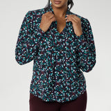 The Celine Top brings refined drama to cool-weather dressing, blending softness, structure, and statement detail in one beautifully cut piece. With its elegant V-neckline and flowing attached neck ties, this blouse offers effortless sophistication, while subtle tailored tucks at the back create a graceful shape that moves easily with the body.