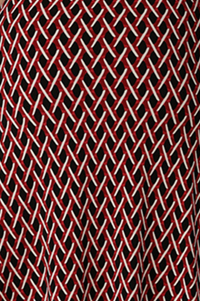 A swatch of red, vanilla and black 'Chevron' print fabric used by Australian fashion brand, Leina & Fleur to make a graphic print dress for work.
