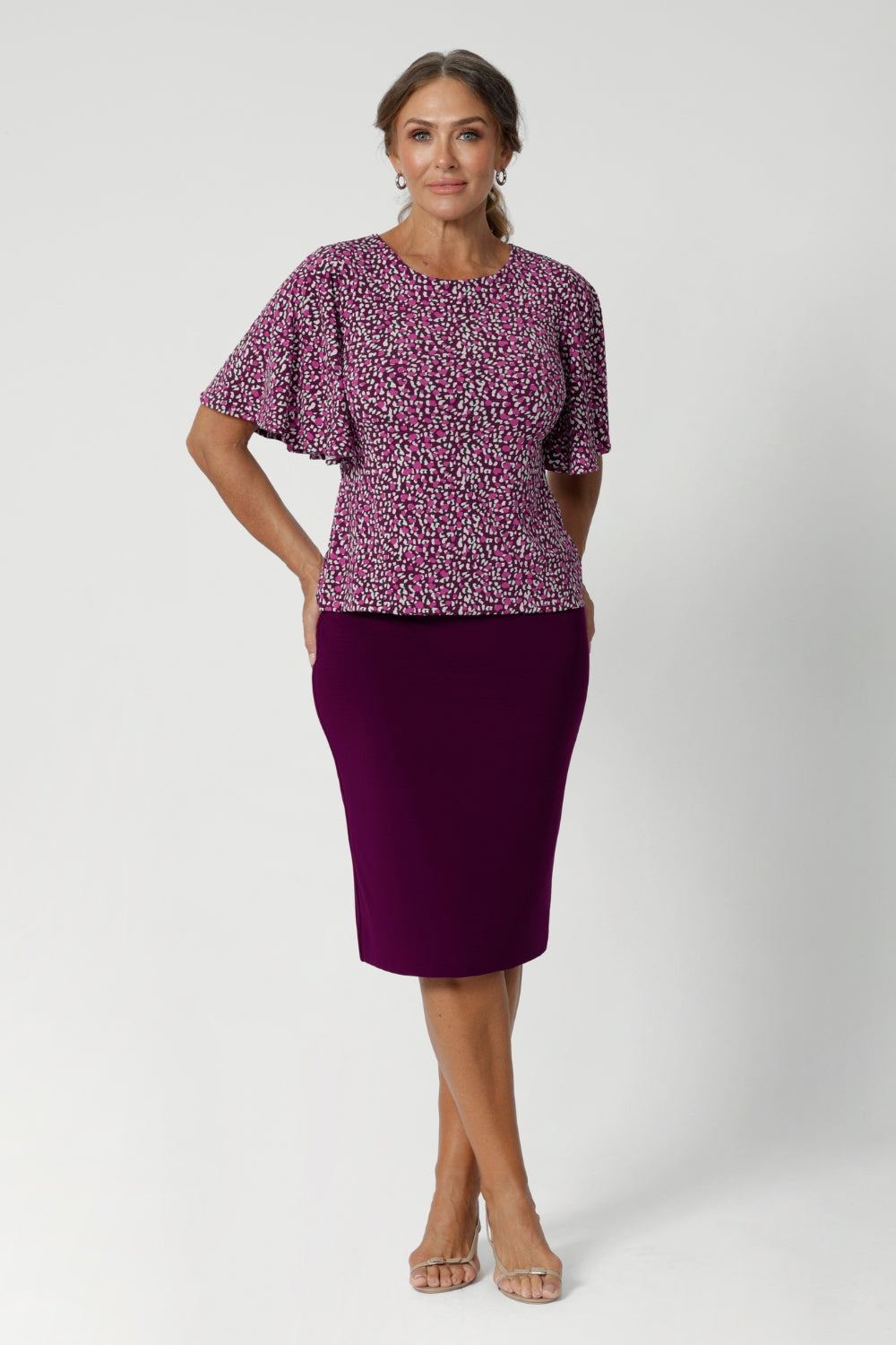 The flutter detail adds movement and softness, enhancing the overall sense of occasion. Flutter sleeved top can also be work with corporate bottoms creating a colourful workwear look. Over 40's woman wears her Chloe Top in size 12.