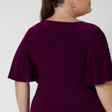 Woman's workwear top in Magenta features straight hemline - easy to tuck into skirts or trousers, making it a versatile piece for the corporate woman on the go. Available in size 8-24 by Australian Designer Leina & Fleur.