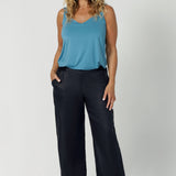 These linen pants are the perfect blend of comfort, style, and sustainability. Designed for effortless wear and modern elegance. The pull-on, mid-rise style offers a relaxed yet flattering fit, while the waistband is crafted from stretch bamboo jersey, providing flexibility and comfort throughout the day. Leina & Fleur stock these linen pants in sizes 8-24.