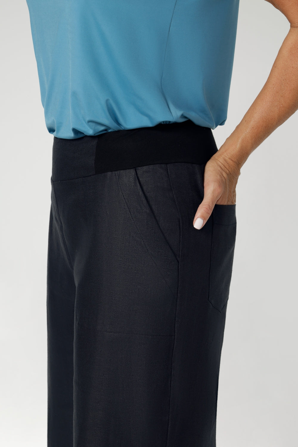 These linen pants feature a stretchy waistband crafted from bamboo jersey, providing extra flexibility and comfort around the waist. These workwear pants are a considered design, made for petite and plus sized woman in sizes 8 through to 24.