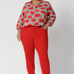 In a bold and vibrant bright tangerine hue, these pants are perfect for those who want to add a pop of colour to their workwear while maintaining a professional appearance. Whether paired with a simple blouse or a structured blazer, these pants offer both comfort and style for the modern woman.