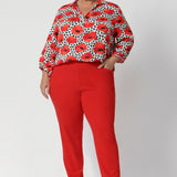 In a bold and vibrant bright tangerine hue, these pants are perfect for those who want to add a pop of colour to their workwear while maintaining a professional appearance. Whether paired with a simple blouse or a structured blazer, these pants offer both comfort and style for the modern woman.