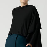 Model is wearing In thermo-regulating, luxurious bamboo jersey Poncho in Black Bamboo by Australian Made brand Leina&Fleur specialising ladies wear in sizes from 8 to 24