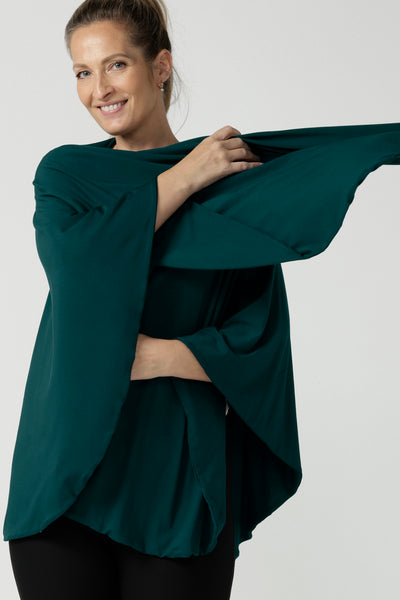 Model is wearing In thermo-regulating, luxurious bamboo jersey Poncho in Black Bamboo by Australian Made brand Leina&Fleur specialising ladies wear in sizes from 8 to 24