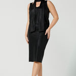 A shimmering jersey neck tie in black puts the finishing touch to a long sleeve, sparkly jersey top for an evening event look. Made in Australia by women's clothing and occasionwear brand, L&F.