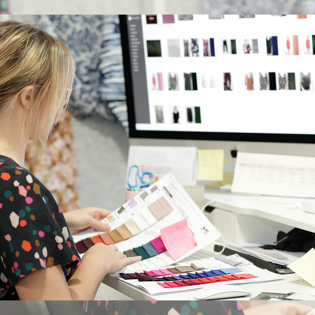 Image shows member of Australian women's clothes brand Leina & Fleur's design team selecting quality fabrics for L&F's sustainable, slow fashion.