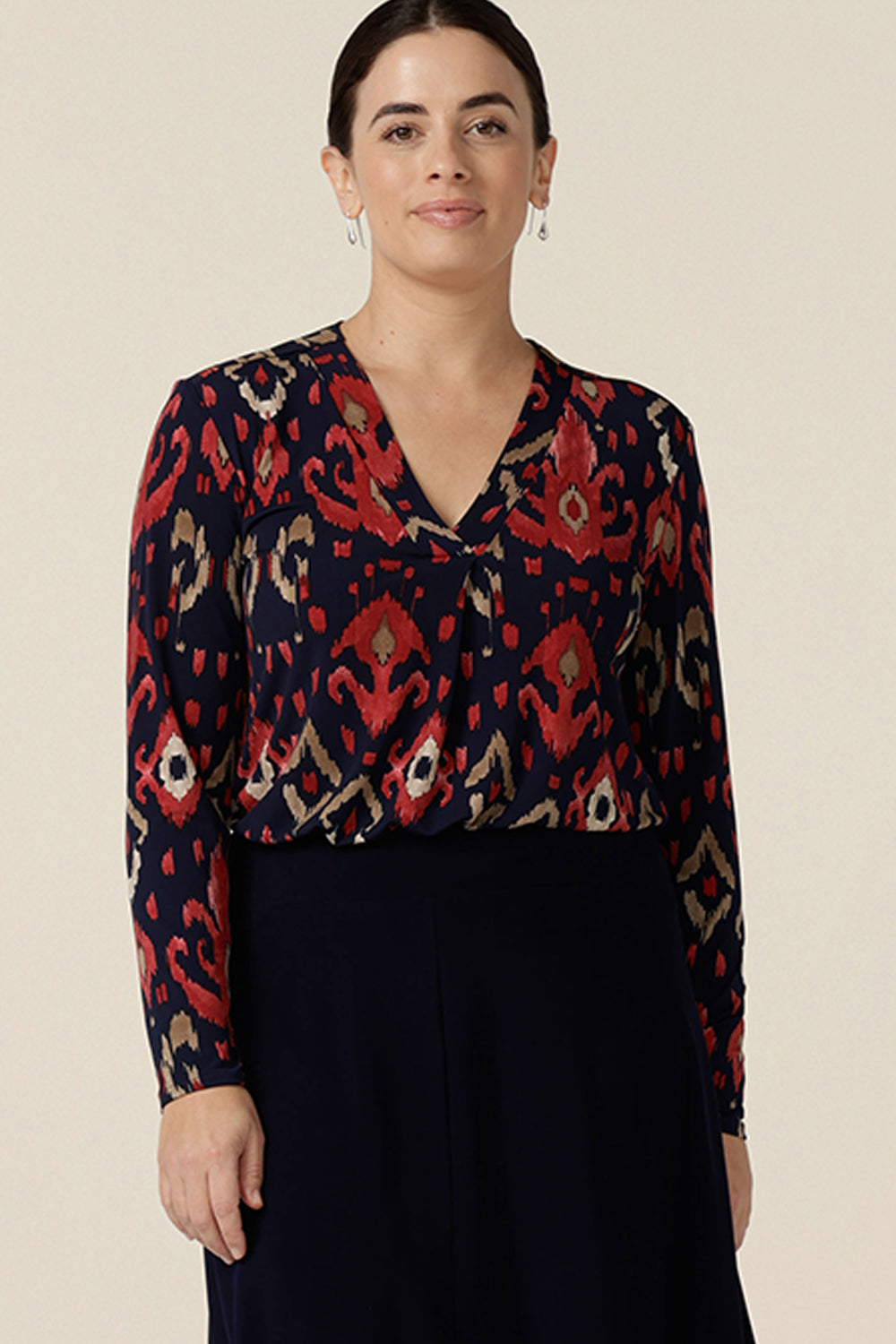 A great workwear top for women, the Dakota Top in Ikat is a V-neck, long sleeve top in soft stretch jersey. Shown here in a size 10, this top is made in Australia in sizes 8 to 24, petite to plus sizes..