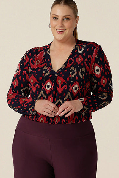 A great workwear top for women, the Dakota Top in Ikat is a V-neck, long sleeve top in soft stretch jersey. Shown here in a size 18 on a curvy woman, this top is made in Australia in sizes 8 to 24, petite to plus sizes.