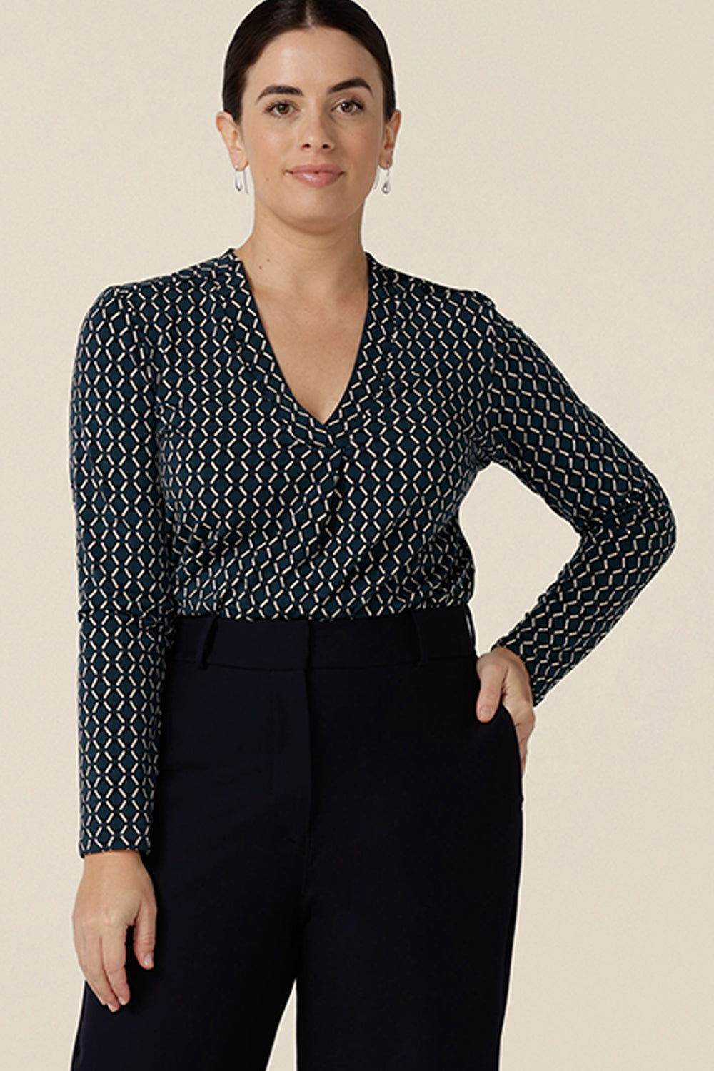 A good work wear top with long sleeves, the Dakota Top is a V neck top in blue and white Infinity print jersey. Made in Australia by Australian and New Zealand women's clothes brand, L&F, shop this smart top in sizes 8 to 24.