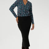 In the vibrant Peacock print, this range comes alive with rich, eye-catching hues of blue, mint, and berry—bringing energy and warmth to grey winter days. The jersey shirt features a flattering V-neckline with a soft front tuck that adds structure without stiffness, full-length sleeves for added coverage, and a gently curved shirttail hem that creates a clean finish whether worn tucked or loose.