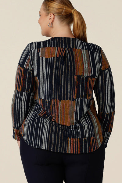 Back view of a casual top for plus size women, this is a V-neck top with long sleeves and shirttail hem. In a fine knit jersey fabric, this non-iron top is made in Australia by women's clothes brand, Leina & Fleur. Shop tops online in sizes 8 to 24.