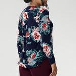Thoughtful design details such as a shoulder yoke with a centre-back tuck and full-length sleeves provide structure and style. The curved shirt-tail hemline offers a gentle, flowing finish, making this floral top ideal for wearing loose or tucked in.