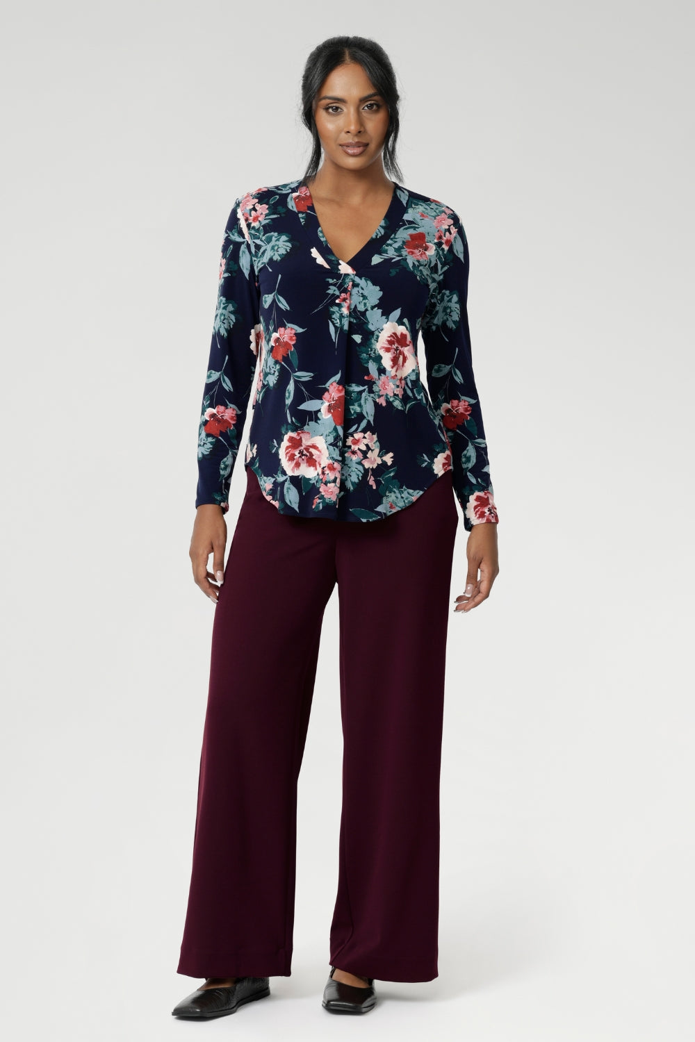 A classic V-neckline is complemented by a tailored front tuck, creating a flattering silhouette that enhances your shape. Thoughtful design details such as a shoulder yoke with a center-back tuck and full-length sleeves provide structure and style. The curved shirt-tail hemline offers a gentle, flowing finish, making this floral top ideal for wearing loose or tucked in. Whether you’re dressing for work, a casual day out, or layering up for the season, the Dakota Top is a must-have addition to your wardrobe.