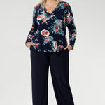 A classic V-neckline is complemented by a tailored front tuck, creating a flattering silhouette that enhances your shape. Thoughtful design details such as a shoulder yoke with a center-back tuck and full-length sleeves provide structure and style. 