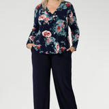A classic V-neckline is complemented by a tailored front tuck, creating a flattering silhouette that enhances your shape. Thoughtful design details such as a shoulder yoke with a center-back tuck and full-length sleeves provide structure and style. 