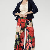 Crafted from our signature dry-touch jersey, the Dany Culotte in Emboldened showcases a bold floral print in red, beige, and green on a deep navy base. 