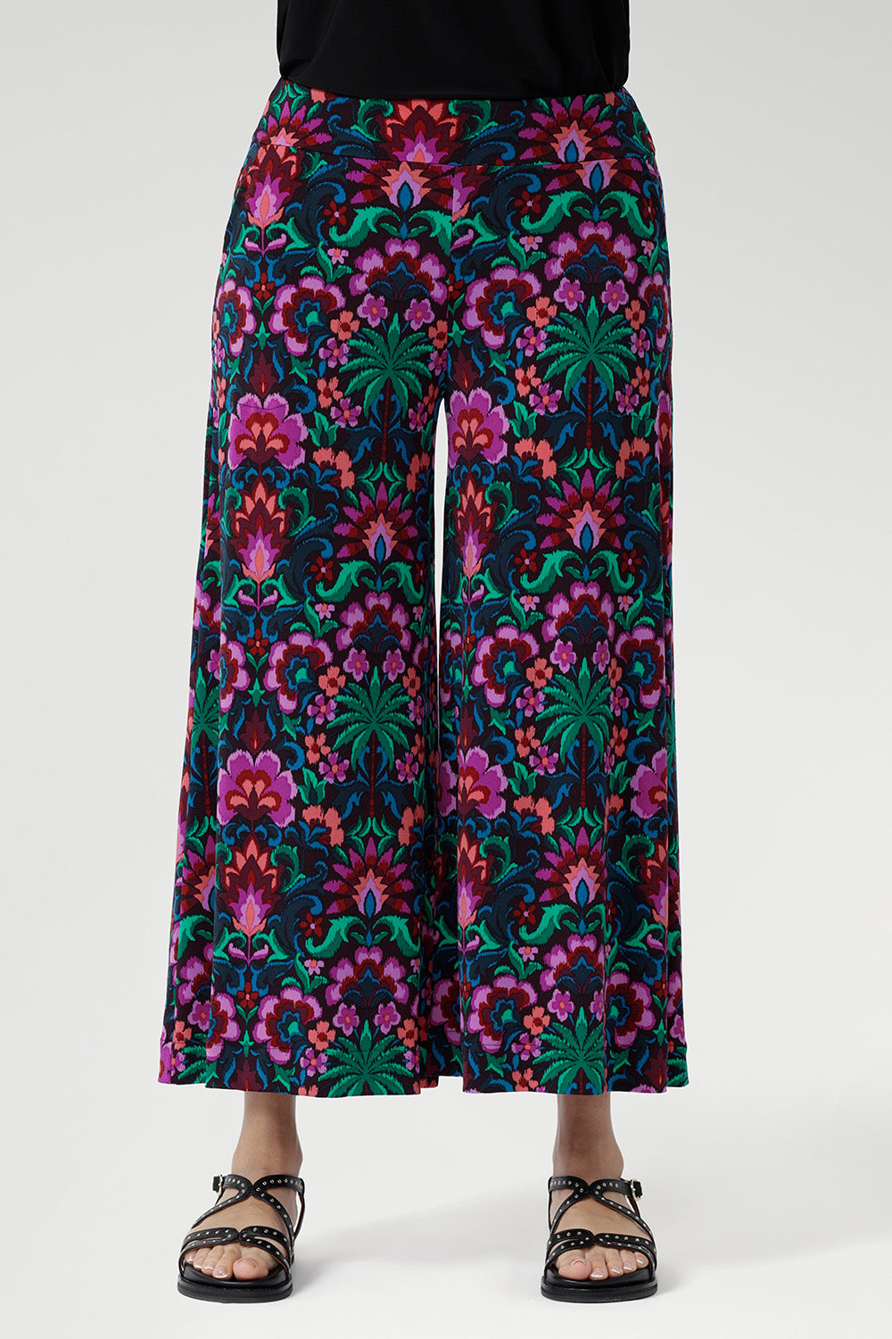 Featuring a bold floral print in vibrant shades of pink, green, burgundy, and blue, these culottes are designed with a modern, extra-wide leg that delivers both style and ease.