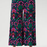Featuring a bold floral print in vibrant shades of pink, green, burgundy, and blue, these culottes are designed with a modern, extra-wide leg that delivers both style and ease.