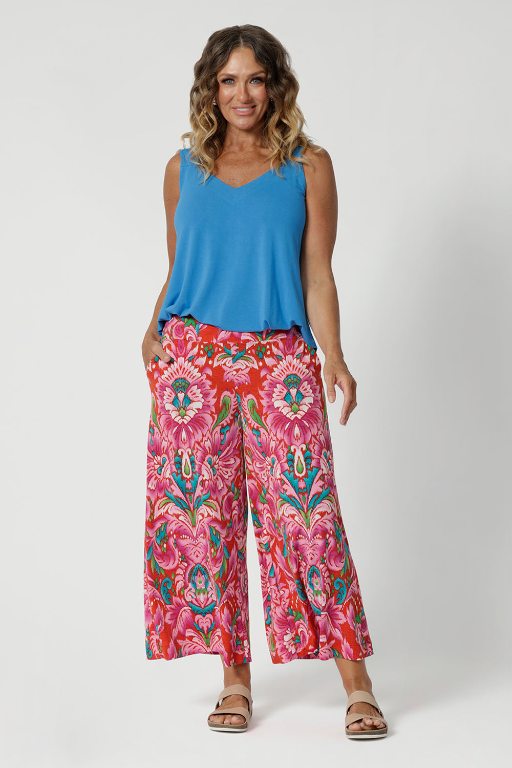 Summer culottes are available in two lengths to suit different heights, shapes and styles. The easy going fit is both modern and laid-back, while the abstract print adds a contemporary flair of summer. Size 12 model pairs her printed culottes with opal coloured cami for a summer day look. Versatile pant can be styled up or down depending on the occasion.