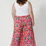 Printed pants worn by sizes 18 woman. Crafted with crepe jersey fabric, offering  cool and comfortable qualities. The jersey fabric’s stretch appeal is ideal for everyday comfort and style. Proudly stocked in sizes 8-24 by fashion label Leina & Fleur.